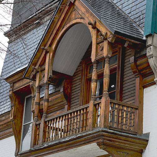 Award-winning photograph Carved Balcony, Quiet Legacy by Joseph Durocher, 2026 MUSE Photography Awards Silver Winner